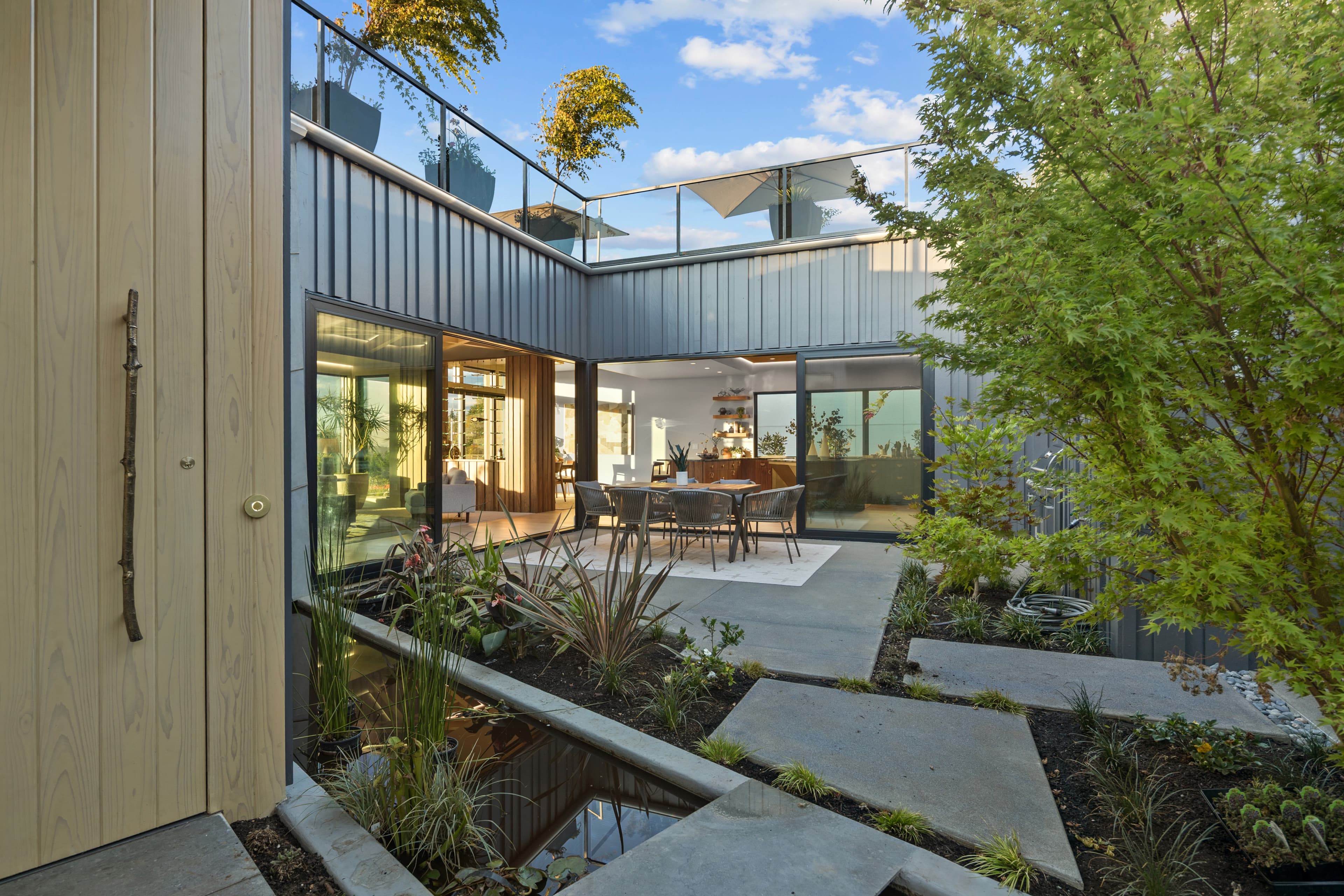 Glass-wrapped central courtyard of the Creekside Homes Street of Dreams house