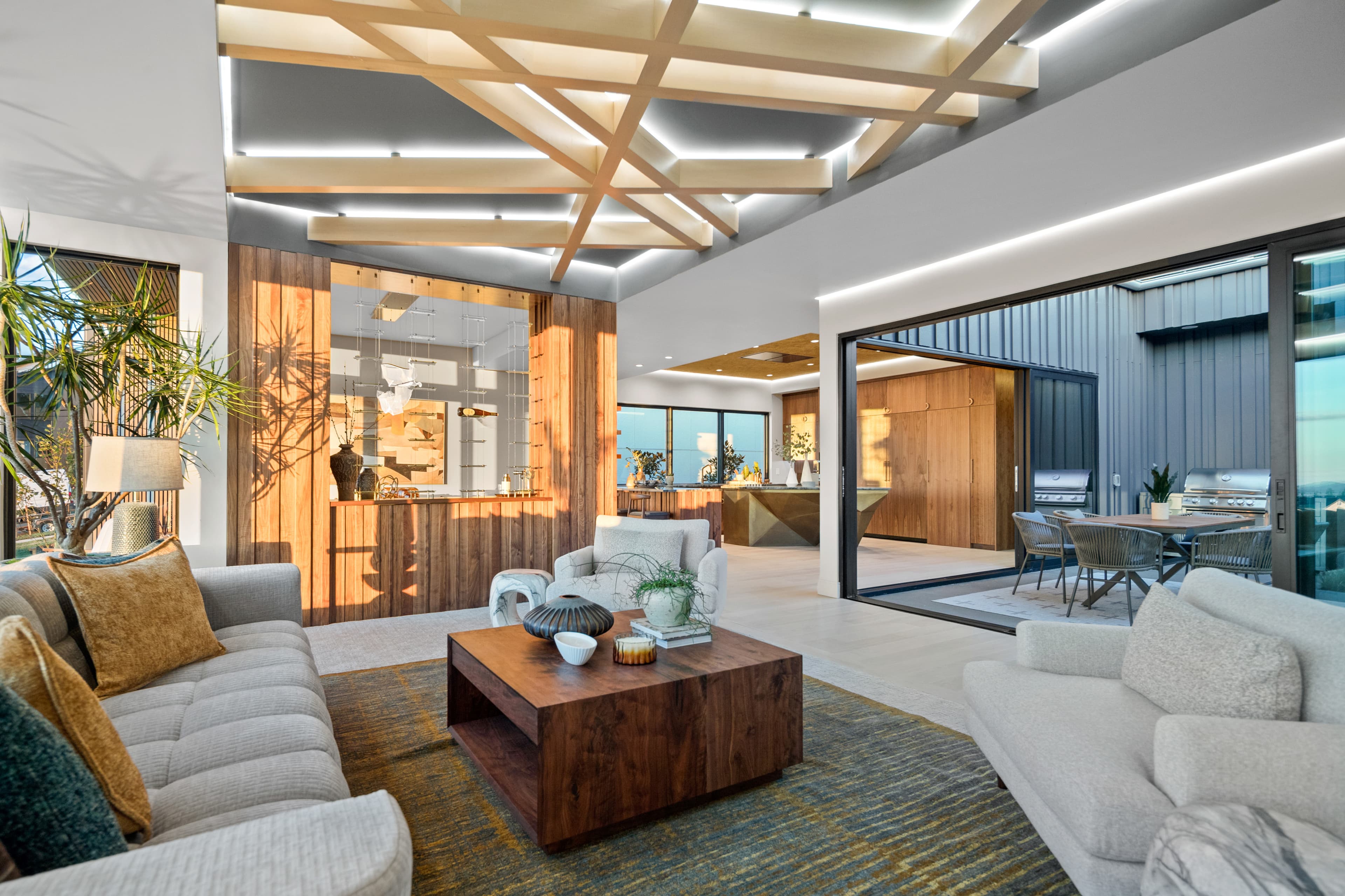 Open-concept great room and dining with a wood-slat ceiling in the Creekside Homes Street of Dreams house